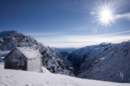 a building on a mountain with snow
