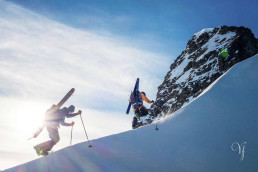 a group of people climbing a snowy mountain