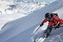 a person skiing down a snowy mountain